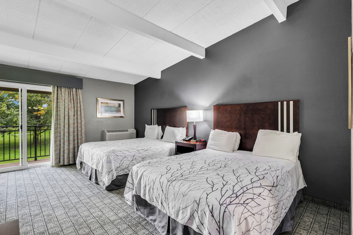 Room, 2 Double Beds | In-room safe, desk, laptop workspace, blackout drapes