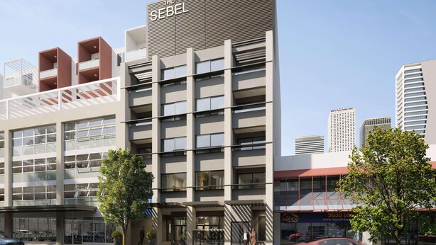 A multi-story hotel with a modern design, featuring balconies, large windows, and a prominent signage. - The Sebel Parramatta (Sydney)
