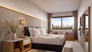 Een moderne hotelkamer met een groot bed, een nachtkastje, een kleine tafel, een bank, een televisie en een raam met uitzicht op de stad.