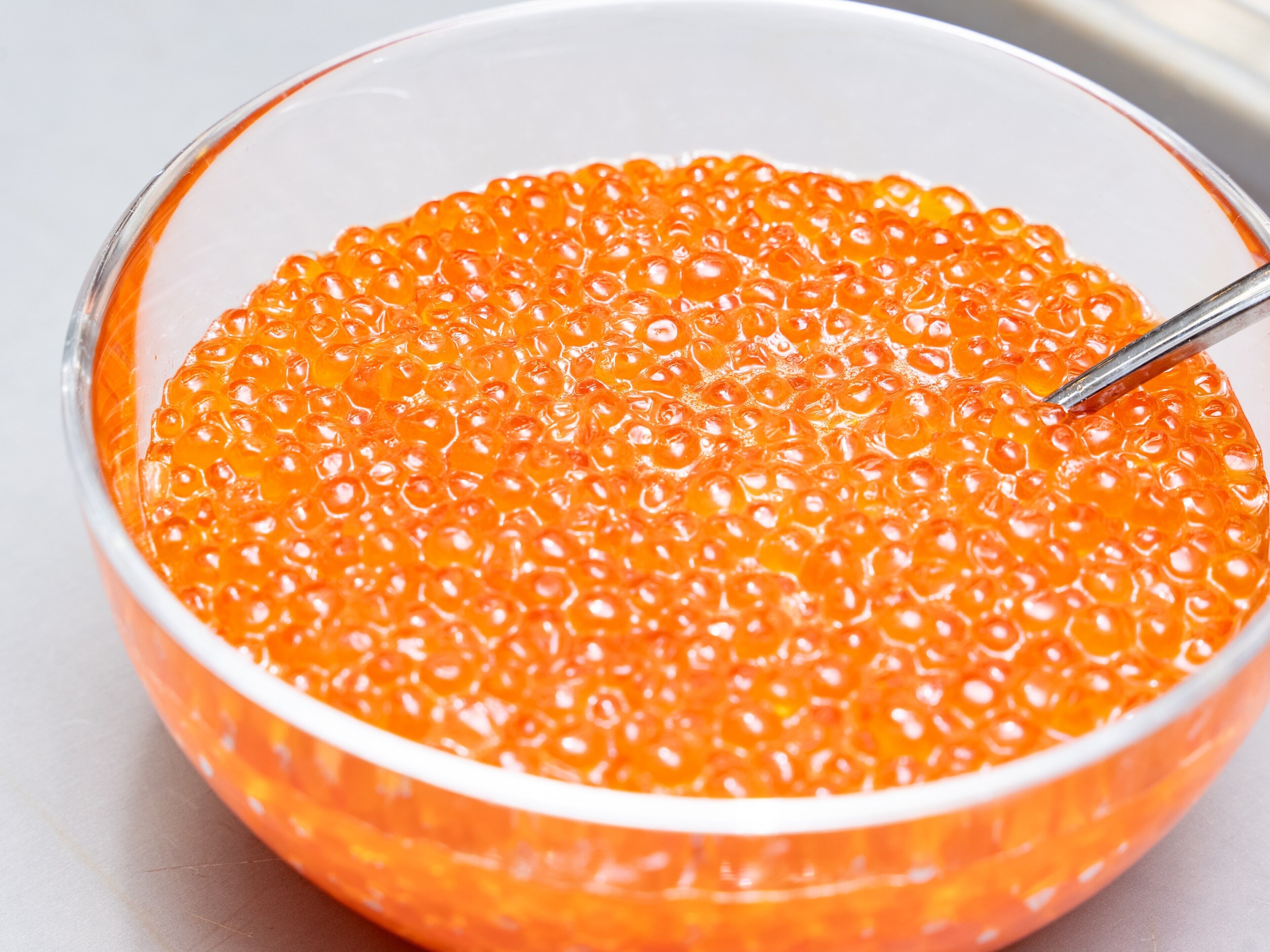 A bowl of orange caviar.