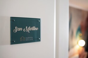 A sign with the text 'San Martino' and 'Zapata Relais' indicating a hotel or establishment. - Zapata Relais - Chiaia (Naples)
