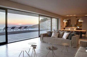 TV, fireplace - Aetos Cave Villa | Sunset Sea Views, 2 Infinity Pools & Private Luxury Retreat (Mylopotas)