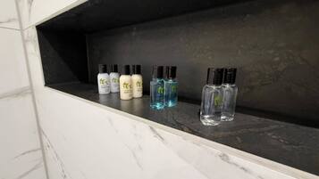 A bathroom shelf with various toiletries.