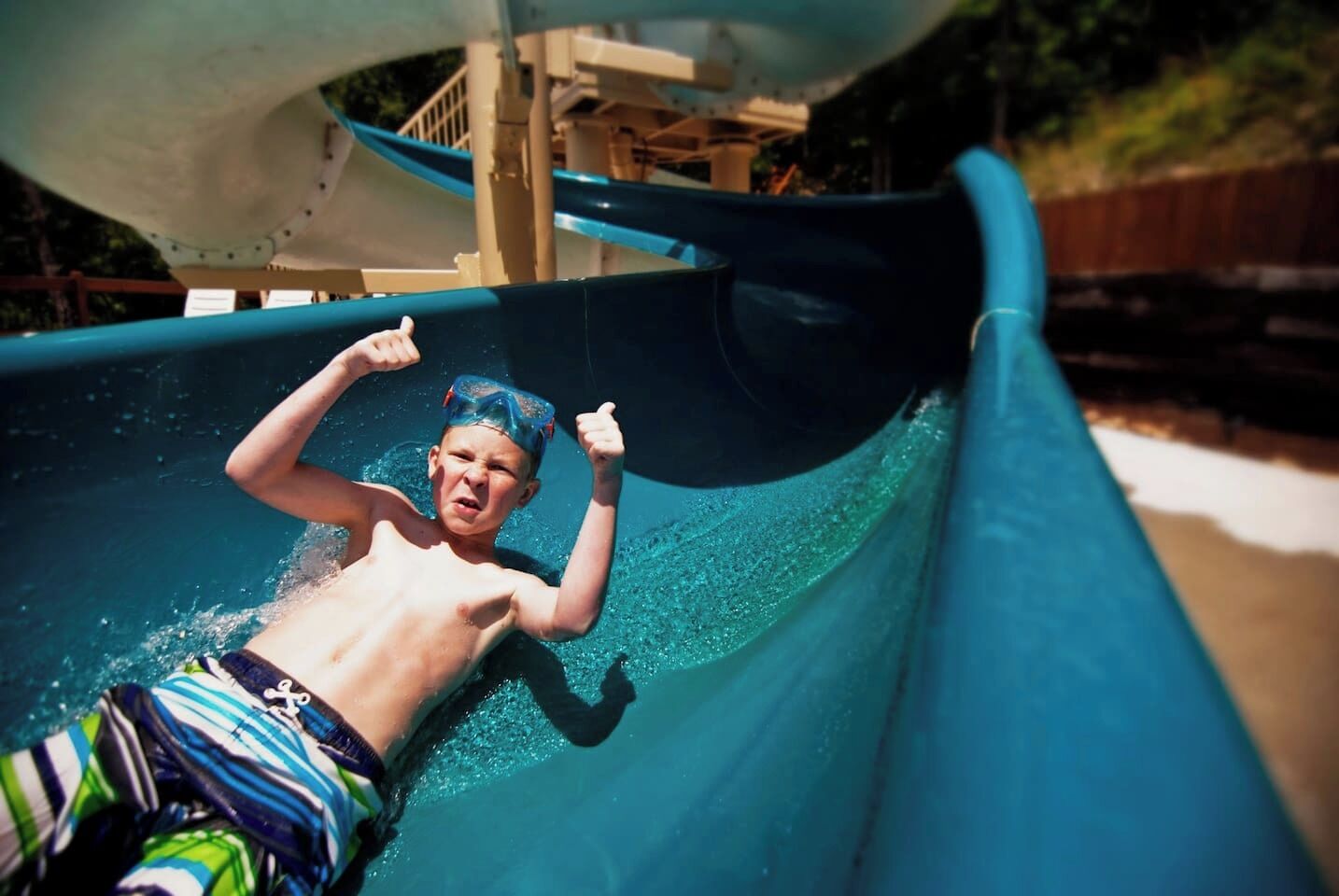 A person sliding down a water slide.