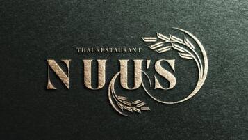 A dark textured surface with the text 'THAI RESTAURANT' and stylized 'NUUS' logo.