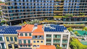 A multi-story building with balconies, solar panels, and a pool area. - Imperatriz 3F by Homie (Funchal)