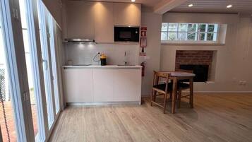 Fridge, stovetop, toaster, cookware/dishes/utensils