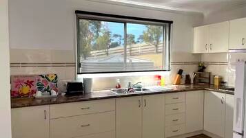 Fridge, microwave, toaster, cookware/dishes/utensils