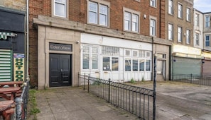 A building with a sign reading 'Eden View' and a closed door.