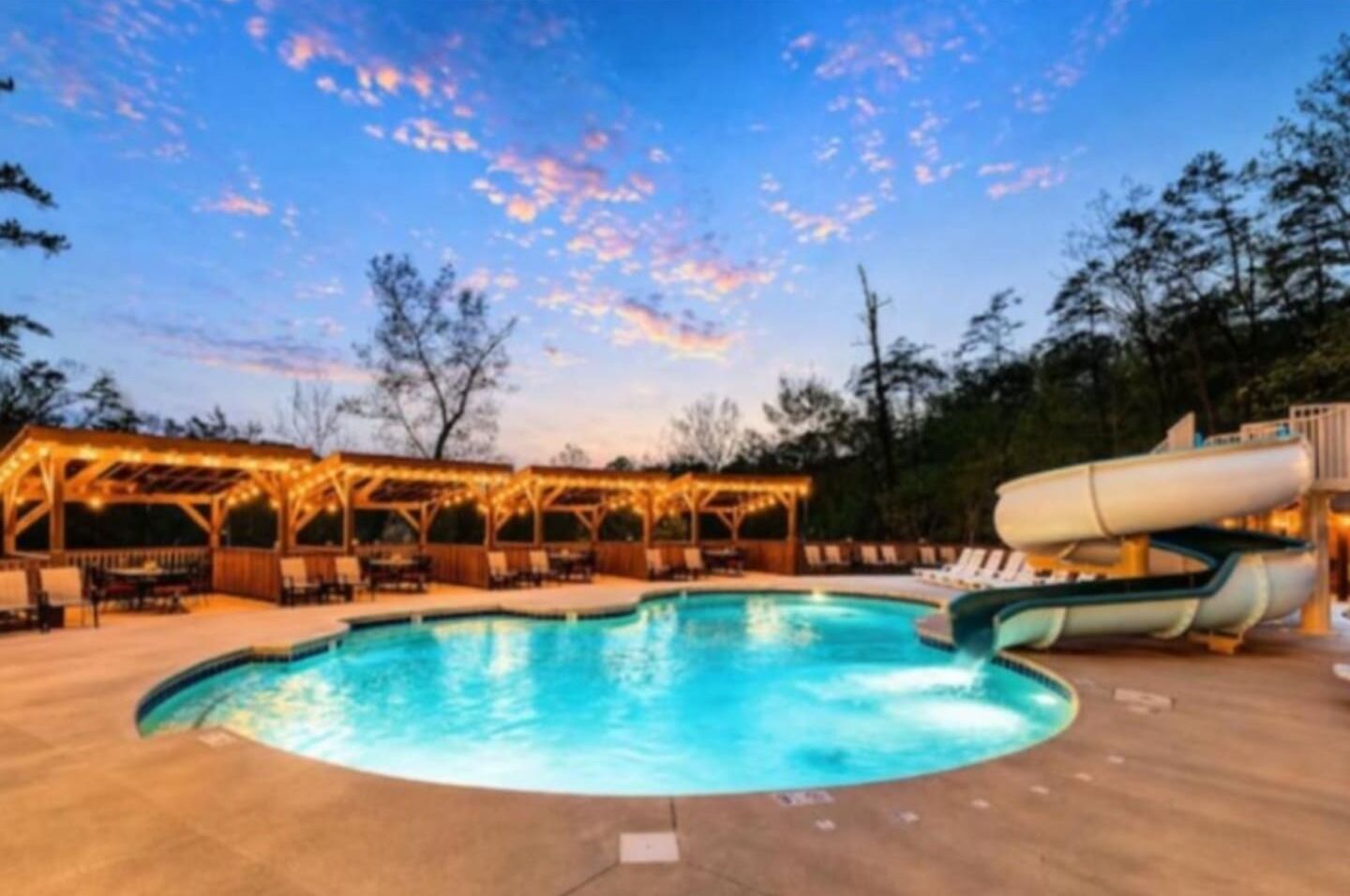 Resort-style outdoor pool with waterslide, sun loungers, and cabana seating available to all guests. Open seasonally. Perfect for families, kids, and anyone wanting to cool off after a day exploring Dollywood or the Smoky Mountains