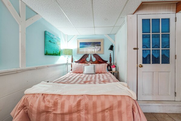 A bedroom with a bed, a door, and wall art. - Covered Deck w/ Water Views! Bath Studio Escape (Bath)