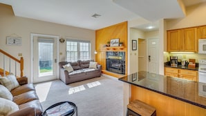 A modern living room with a sofa, a coffee table, and a fireplace. - Pool Access! Amazing Mtn Retreat in Mercersburg (Mercersburg)