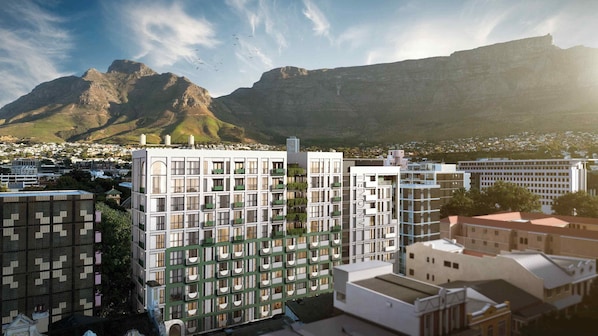 A modern building with multiple floors, large windows, and balconies. - TEN on V - Fluent Serviced Apartments (Cape Town)