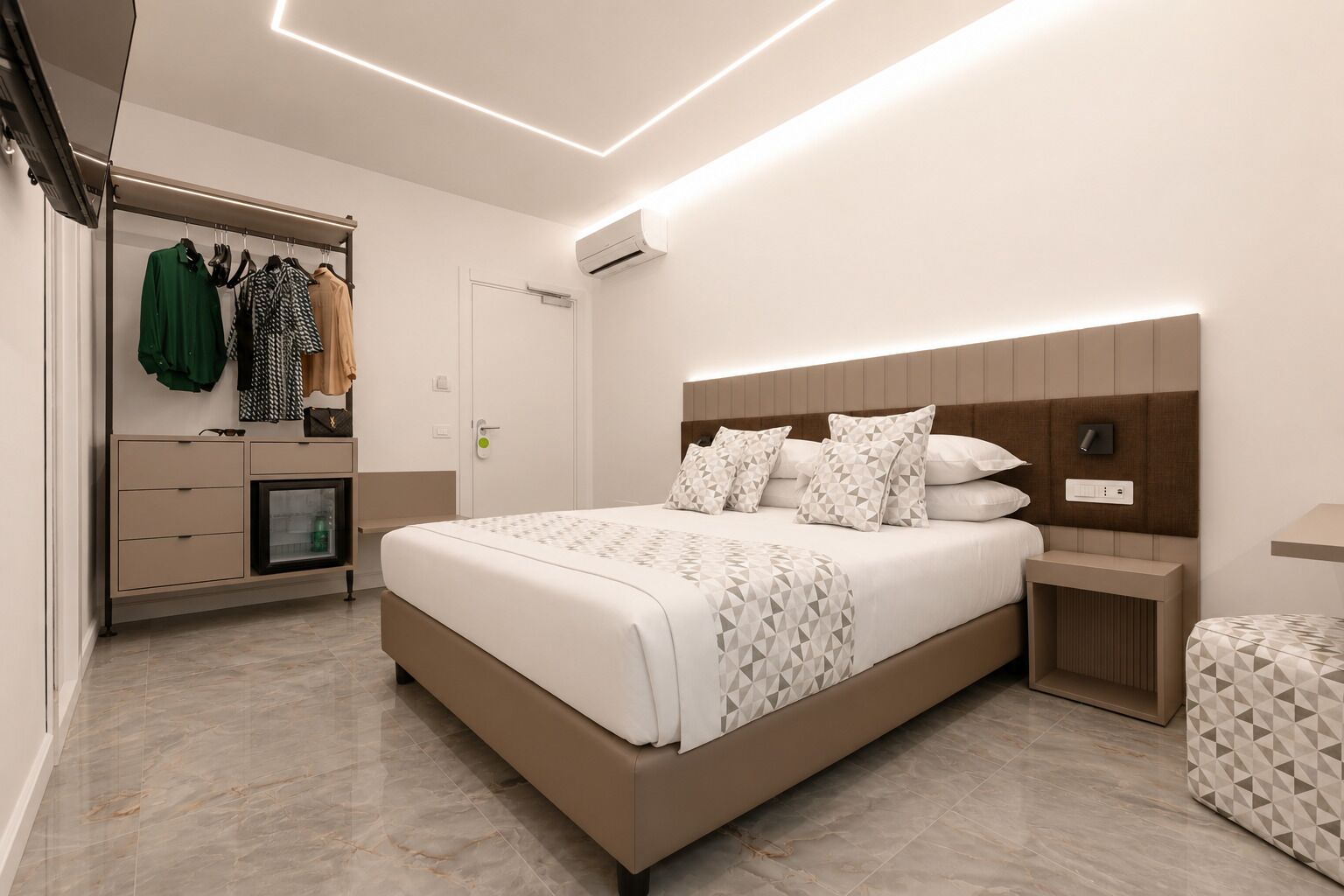 A modern bedroom with a large bed, bedside tables, a wardrobe, and an air conditioning unit.