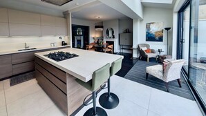 A modern kitchen with a central island, a dining area with chairs, and a large window. - 2 Private Ensuite Rooms Shared With Friendly Host (London)