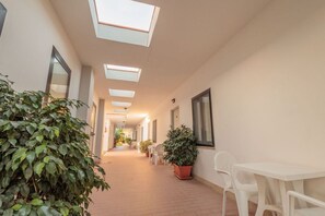 Outdoor dining - Marina Living Rooms – Economy Double Room with Shared Pool, Wi-Fi, and Air Conditioning (Laura)