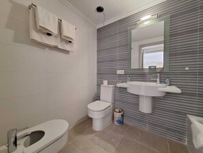 Shower, towels, soap, toilet paper