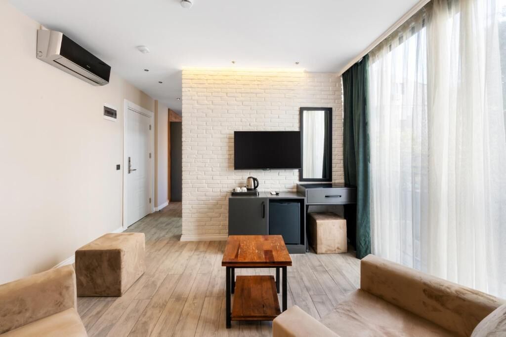 Deluxe suite, balkon, uitzicht op stad | Woonruimte