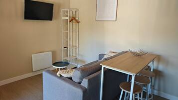 Casa conforto, vista para o jardim | Área de estar