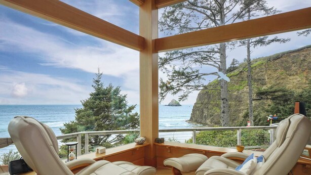 A balcony with three cushioned chairs and a view of the ocean. - *New Listing* Breathtaking Views of Endless Ocean (Oceanside)