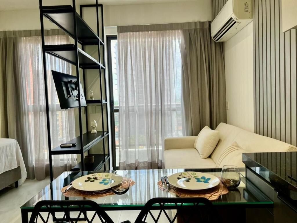 Apartamento conforto, vista para a cidade | Área de estar