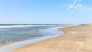 A beach with a clear sky and calm sea. - 3BR Seabrook Home, Pet Friendly, Near Beach-Pools, Golf, Equestrian and Tennis (Seabrook Island)