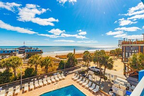 A resort with a pool, beach view, and multiple buildings. - Yachtsman S403B Studio (Myrtle Beach)