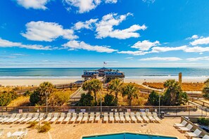A beachside hotel with a pool, sun loungers, and a view of the ocean. - Yachtsman S403B Studio (Myrtle Beach)