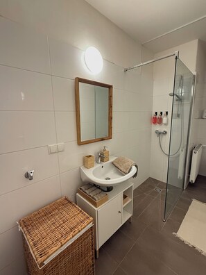 Shower, hair dryer, towels, soap