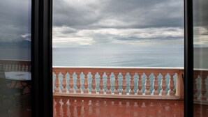 A balcony with a railing, a view of the sea, and a cloudy sky. - Villa Margi · Pool · Sea View (Vico Equense)