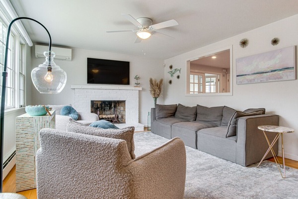 Living Room | Wall-Mounted Smart TV | Fireplace Hearth & Ceiling Fan