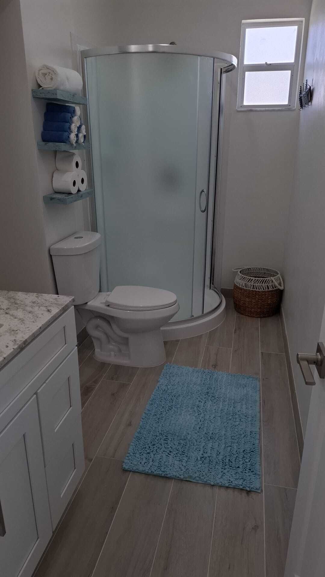 Shower, hair dryer, towels, soap