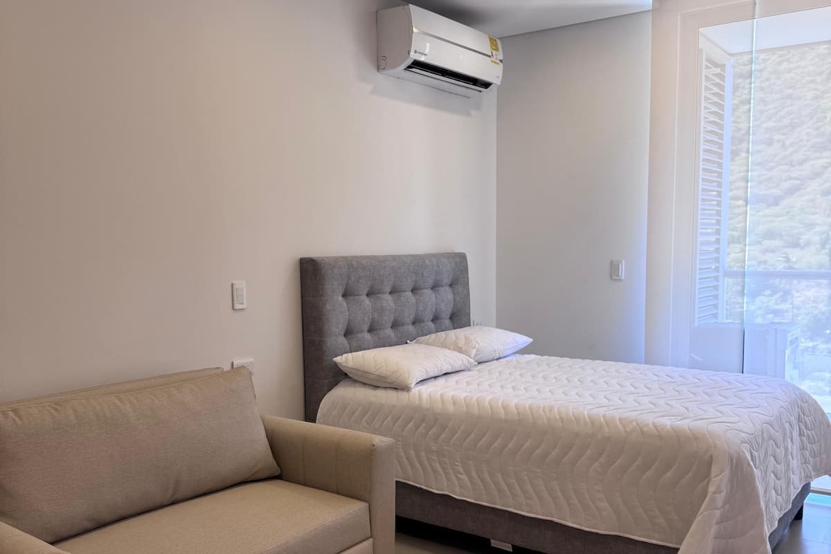 Deluxe Apartment, Balcony, Ocean View | Desk, laptop workspace, blackout drapes, soundproofing