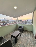 Deluxe Suite, Balcony, City View | Terrace/patio