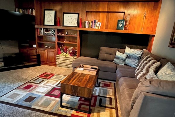 Smart TV, fireplace, books, offices
