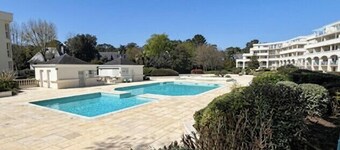 Apartment with pools and garden near the beach