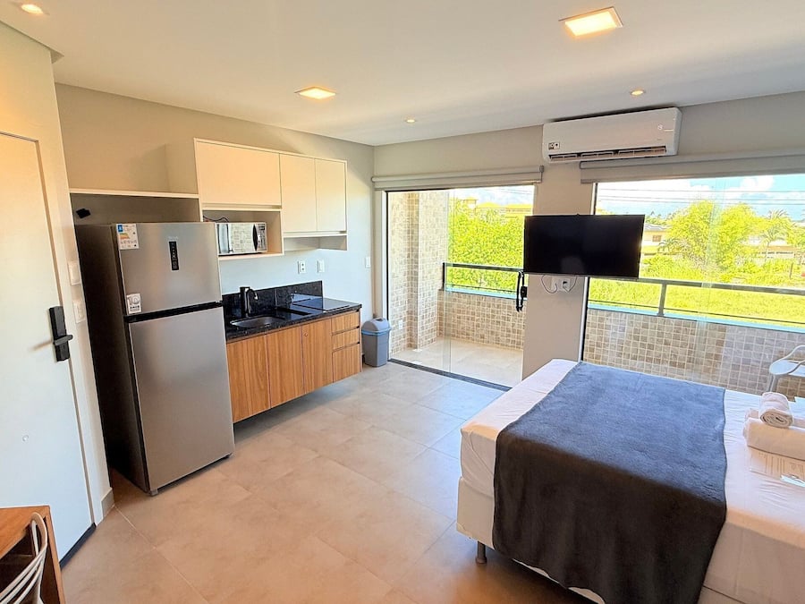 Basic Studio | Select Comfort beds, desk, laptop workspace, blackout curtains