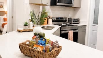 Coffee/tea maker, fridge, microwave, oven