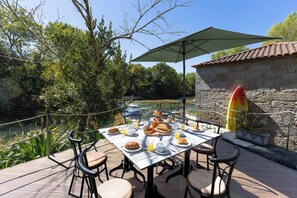 Outdoor dining - Riverside Watermill House · Private Beach Access (Caminha)