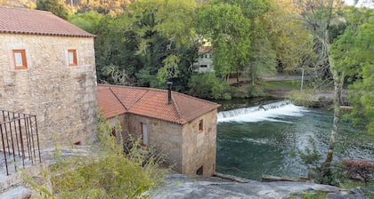 Moulin Ă eau centenaire sur la plage de la riviĂšre by Portugal Active