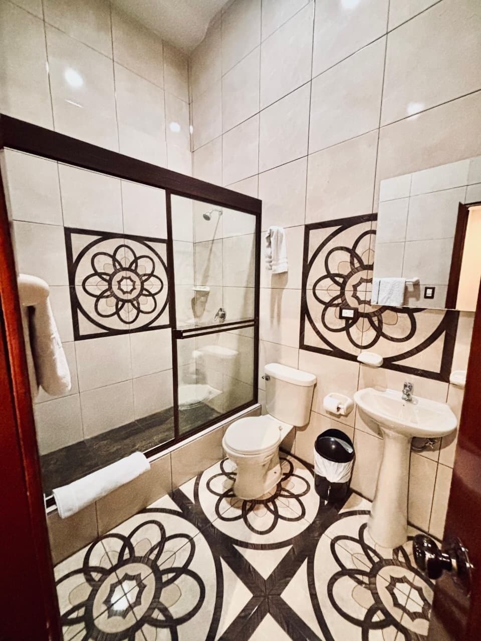 Shower, rainfall showerhead, hair dryer, towels