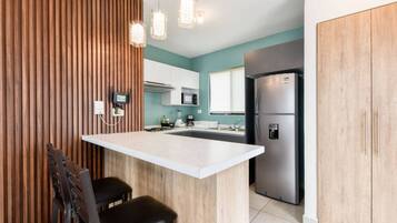 Fridge, microwave, stovetop, coffee/tea maker