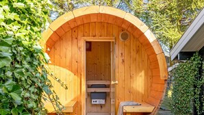 A wooden sauna with a bench, a door, and a small shelf. - "Tjarko" - 690m to the fjord by Interhome (Storvorde)