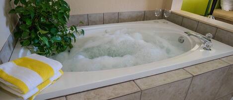 Jetted bath, hair dryer, towels, soap
