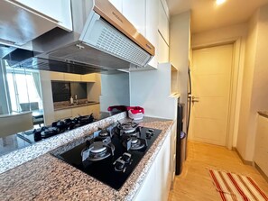 Fridge, microwave, oven, stovetop - Padi Suites Casa Grande, 2BR Apartment Direct Mall Access (South Jakarta)