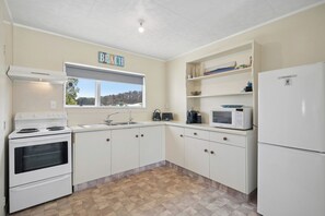 Fridge, microwave, coffee/tea maker, toaster - Bach to the Beach - Foxton Beach Holiday Home (Foxton)