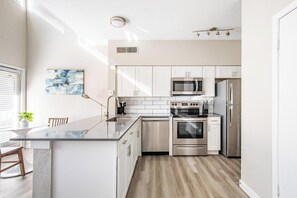 Fridge, dining tables - Landing | Stunning 1BD, Courtyard, Pool (Fort Worth)