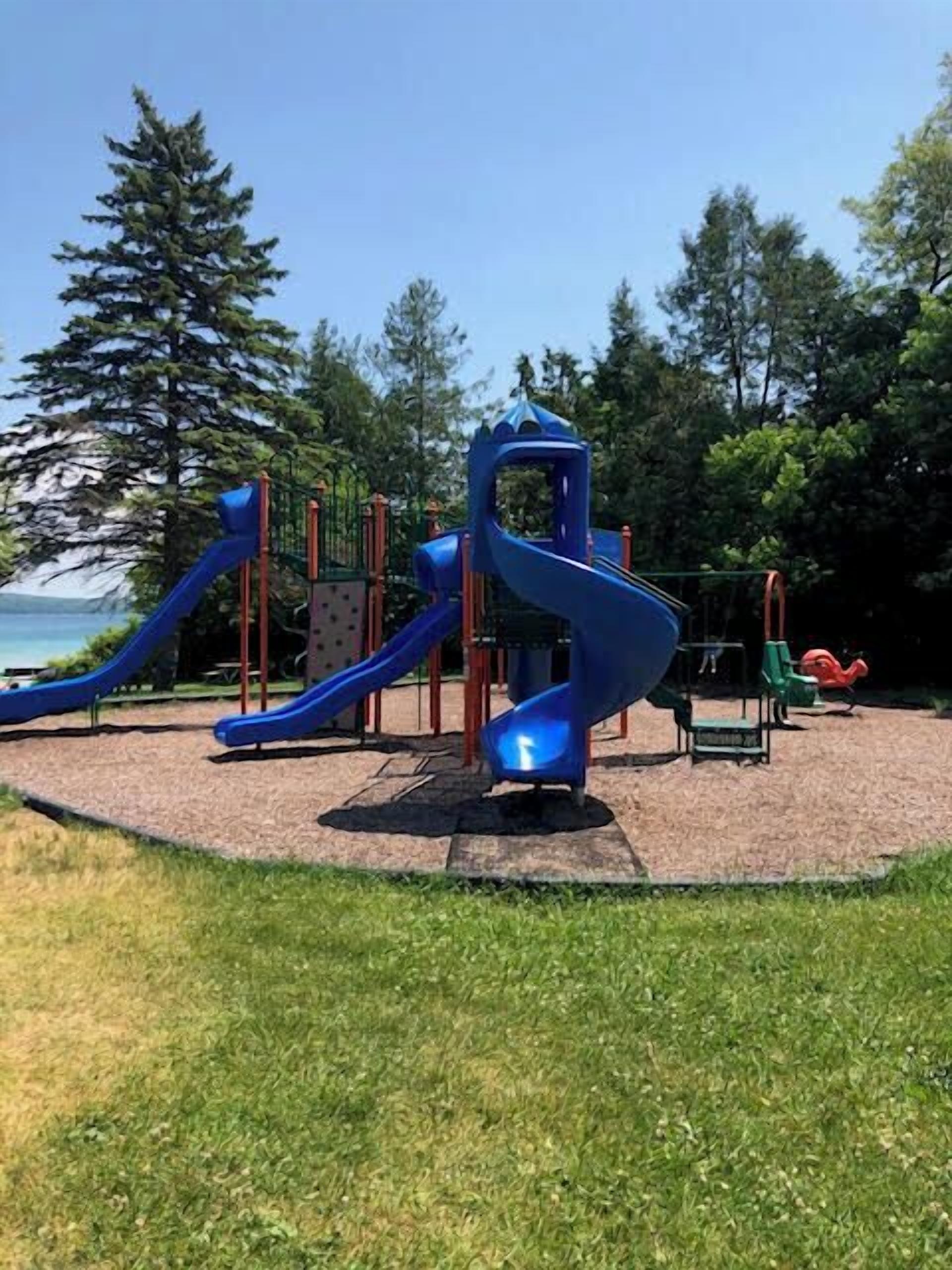 A playground with slides and climbing structures.