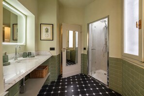 A bathroom with a double sink, a shower, and a tiled floor. - Spada Boutique Frescoed Luxury Suite with Elevator (Firenze)
