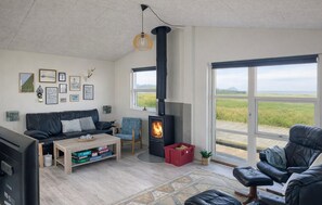 TV, fireplace - Beach front home in Hjørring with house sea view (Hjørring)